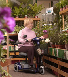woman on scooter in garden shop